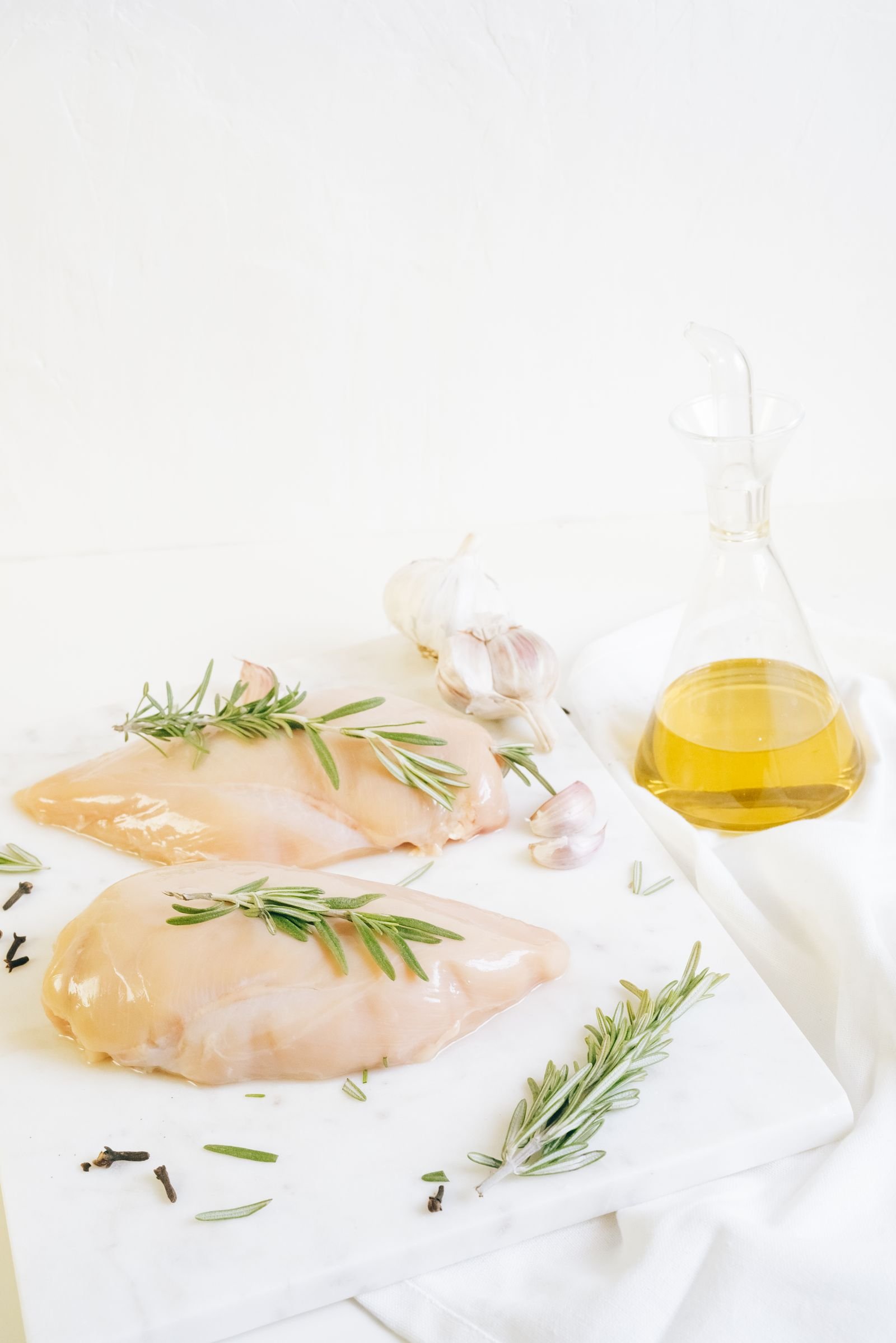 Fresh chicken breast cuts prepared with rosemary and garlic