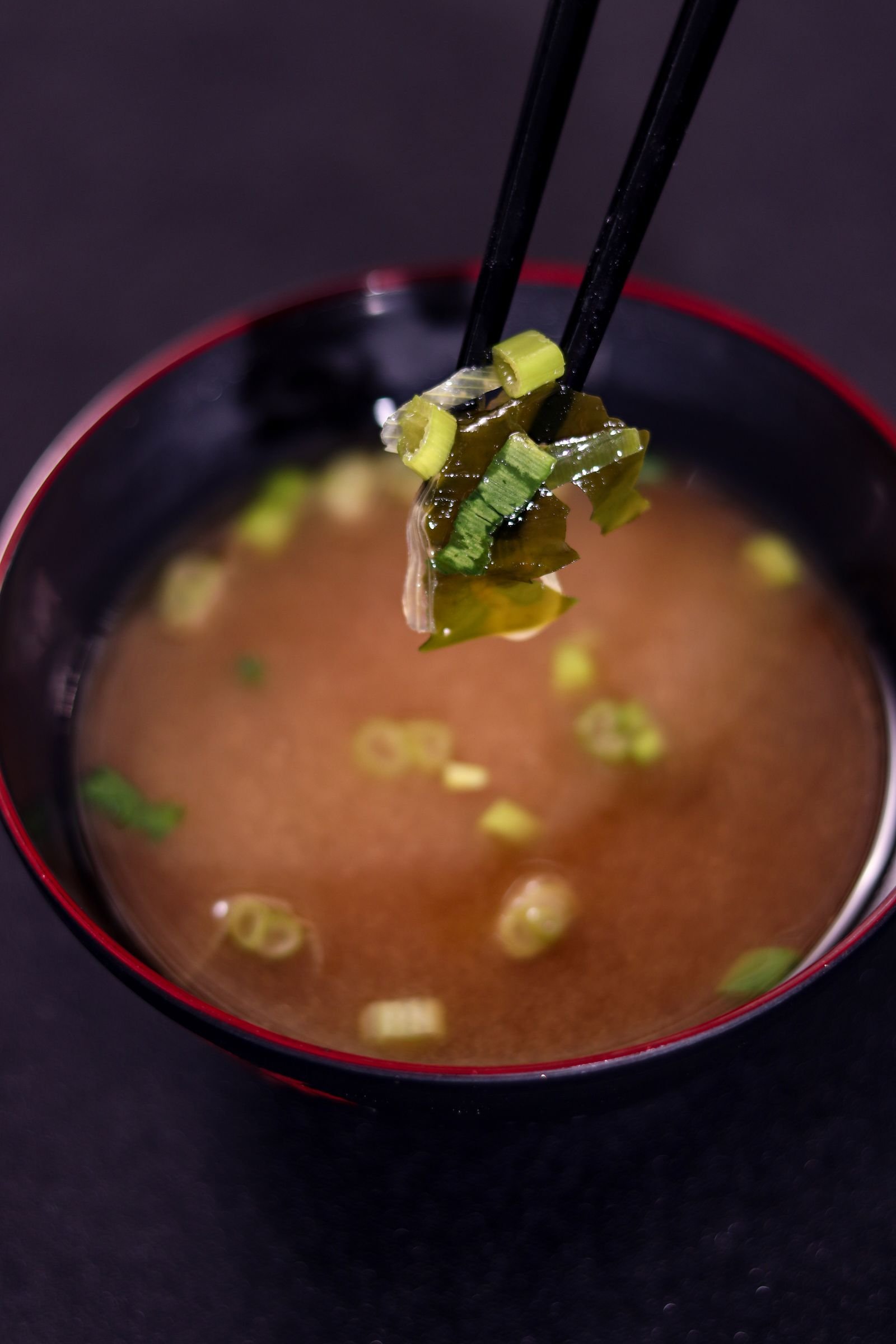 Japanese miso broth with seaweed and spring onion