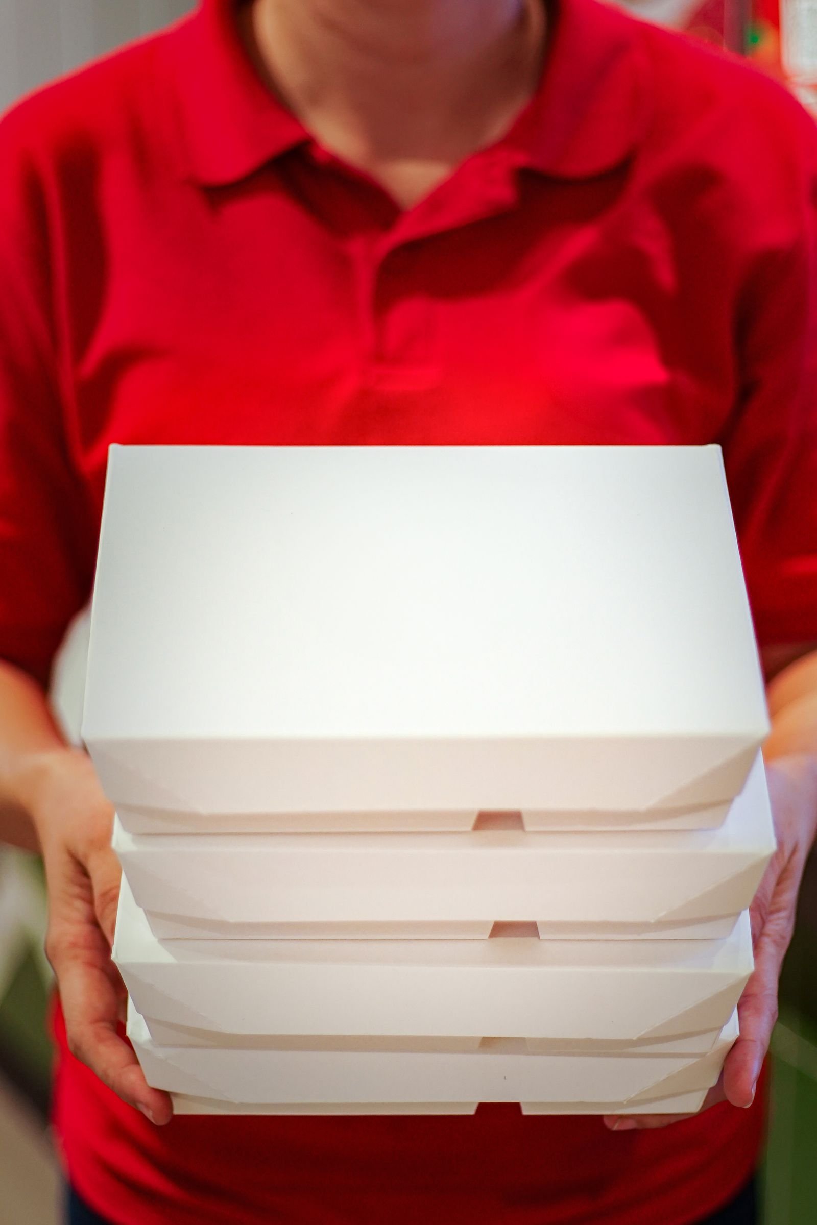 Plain white food delivery boxes ready for label development