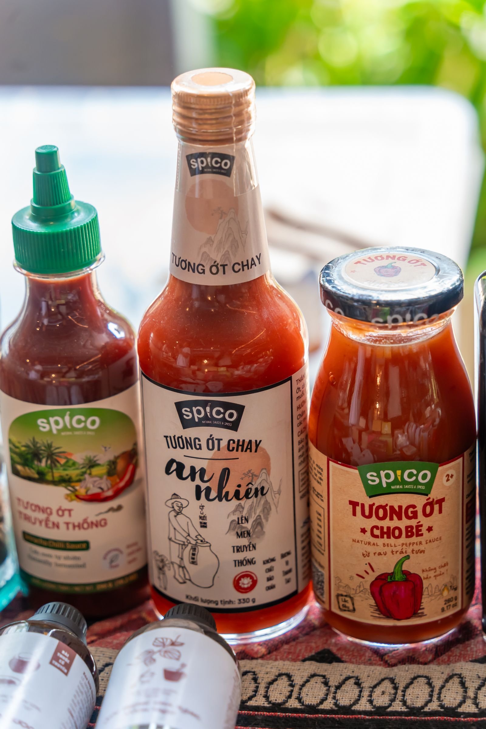 Bottles of Asian chilli sauces and condiments
