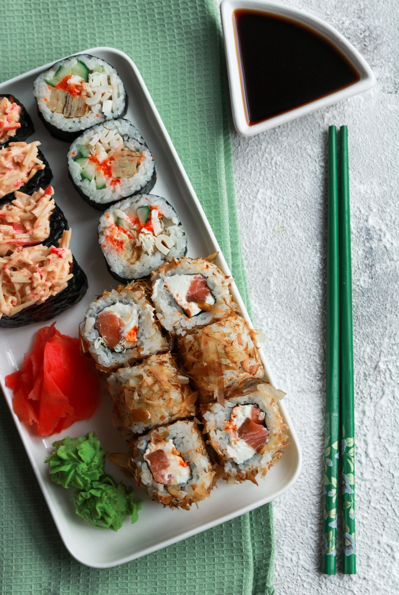 Sushi rice, nori, seafood, ginger, wasabi and soy sauce